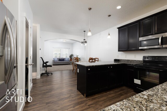 671 E 330 N, Vineyard, UT 84059 - kitchen featuring appliances with stainless steel finishes, arched walkways, dark wood-style flooring, dark stone counters, and open floor plan