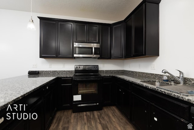 671 E 330 N, Vineyard, UT 84059 - kitchen with stainless steel microwave, black electric range oven, a sink, dark cabinets, and dark wood finished floors