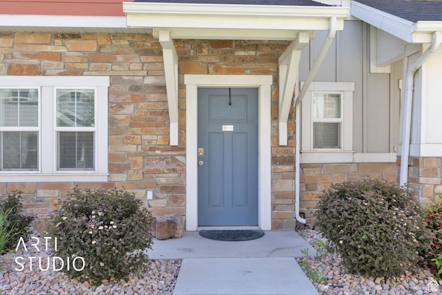671 E 330 N, Vineyard, UT 84059 - entrance to property featuring a shingled roof, board and batten siding, and stone siding