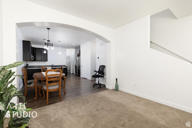 671 E 330 N, Vineyard, UT 84059 - dining room with arched walkways, dark carpet, and baseboards