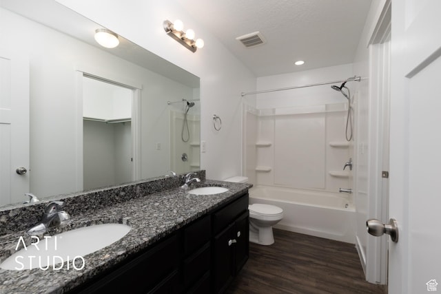 671 E 330 N, Vineyard, UT 84059 - bathroom with toilet, double vanity, shower / bathtub combination, wood finished floors, and a textured ceiling