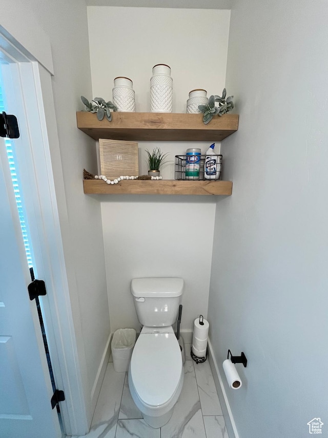 3198 N 3475 W, Plain City, UT 84404 - bathroom with marble look tiles, toilet, and baseboards