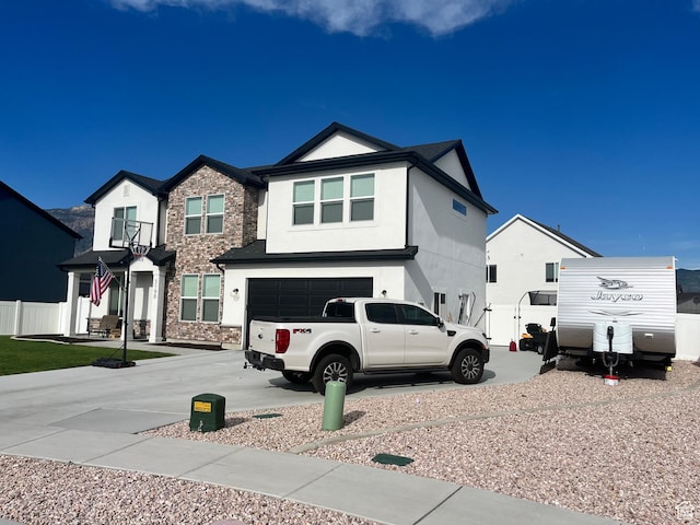 3198 N 3475 W, Plain City, UT 84404 - view of front of property with stucco siding, an attached garage, and driveway