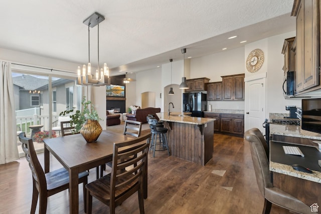 261 W 1200 S, Lehi, UT 84043 - dining area with dark wood-type flooring, arched walkways, a chandelier, a textured ceiling, and recessed lighting