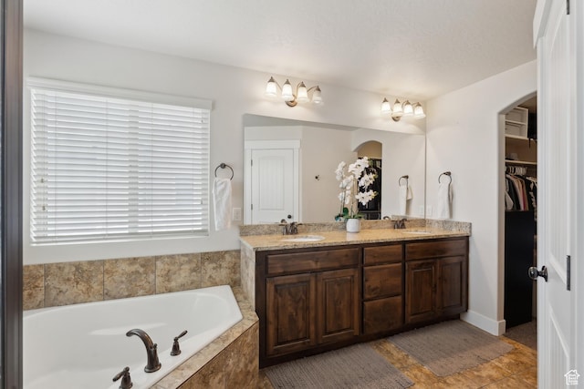 261 W 1200 S, Lehi, UT 84043 - full bathroom with double vanity, a bath, a walk in closet, and tile patterned flooring