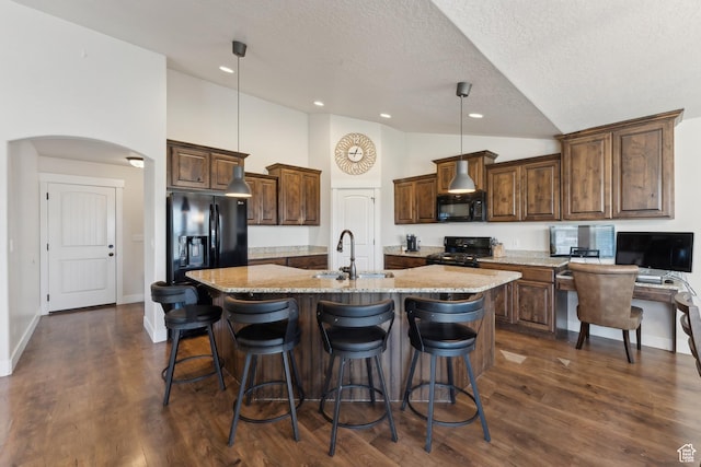 261 W 1200 S, Lehi, UT 84043 - kitchen featuring a sink, black appliances, a textured ceiling, a large island, and light stone counters