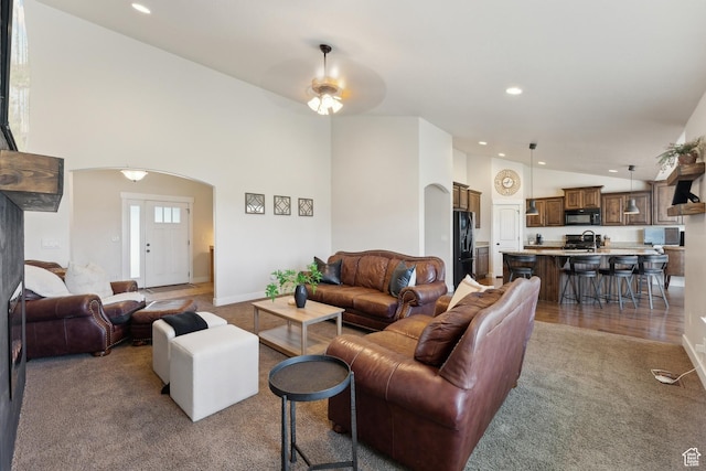 261 W 1200 S, Lehi, UT 84043 - living room featuring arched walkways, carpet, recessed lighting, a ceiling fan, and baseboards