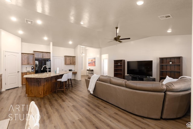3504 E 3140 S, St George, UT 84790 - living area featuring lofted ceiling, a ceiling fan, wood finished floors, and recessed lighting