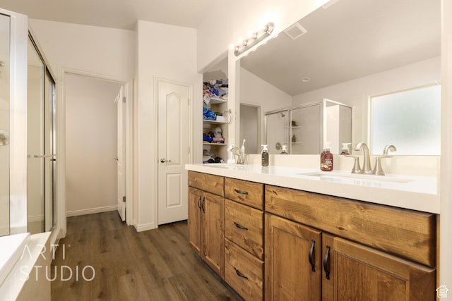 3504 E 3140 S, St George, UT 84790 - full bath with a stall shower, double vanity, wood finished floors, lofted ceiling, and a bathtub