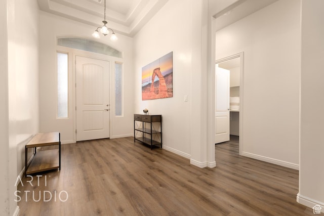 3504 E 3140 S, St George, UT 84790 - entrance foyer featuring wood finished floors, a chandelier, baseboards, and a tray ceiling