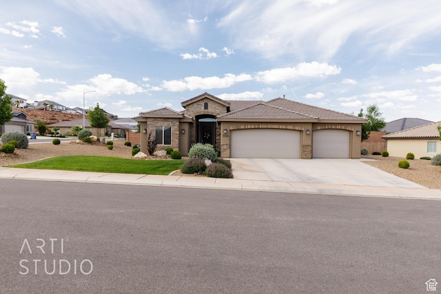 3504 E 3140 S, St George, UT 84790 - view of front of home with stone siding, driveway, a garage, a tile roof, and stucco siding