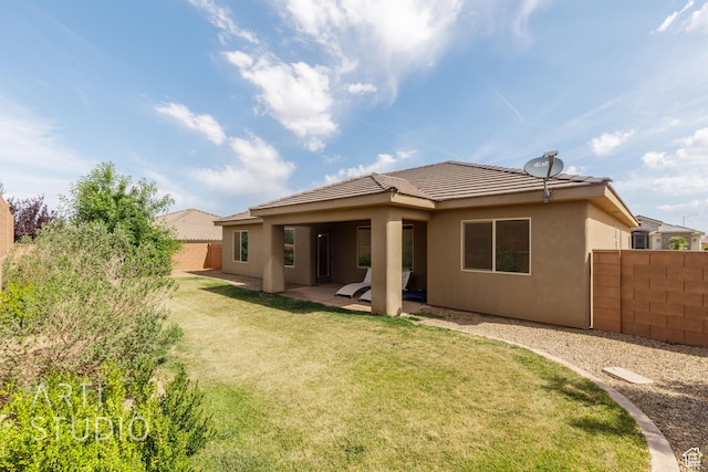 3504 E 3140 S, St George, UT 84790 - back of house with stucco siding, a tiled roof, and a patio area