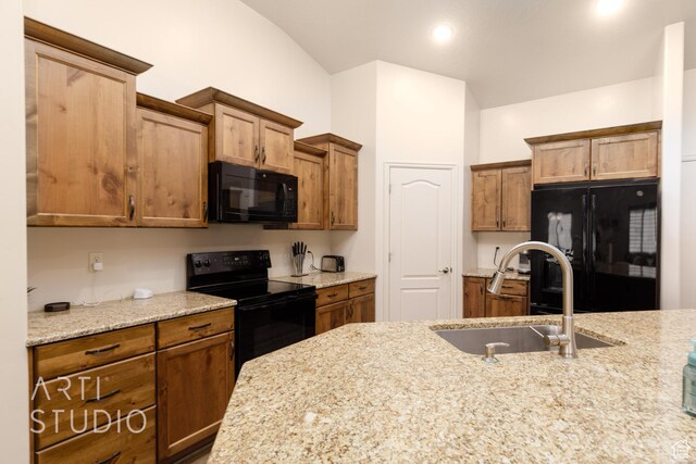 3504 E 3140 S, St George, UT 84790 - kitchen with black appliances, a sink, lofted ceiling, brown cabinets, and light stone counters