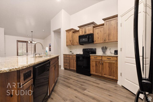 3504 E 3140 S, St George, UT 84790 - kitchen with black appliances, a sink, wood finished floors, and brown cabinets