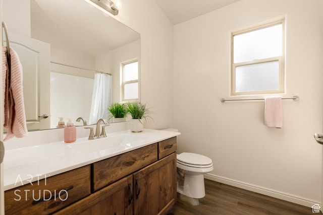 3504 E 3140 S, St George, UT 84790 - bathroom featuring toilet, vanity, wood finished floors, baseboards, and curtained shower