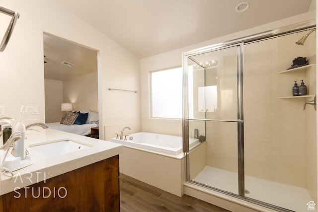 3504 E 3140 S, St George, UT 84790 - bathroom with wood finished floors, vanity, a garden tub, and a stall shower