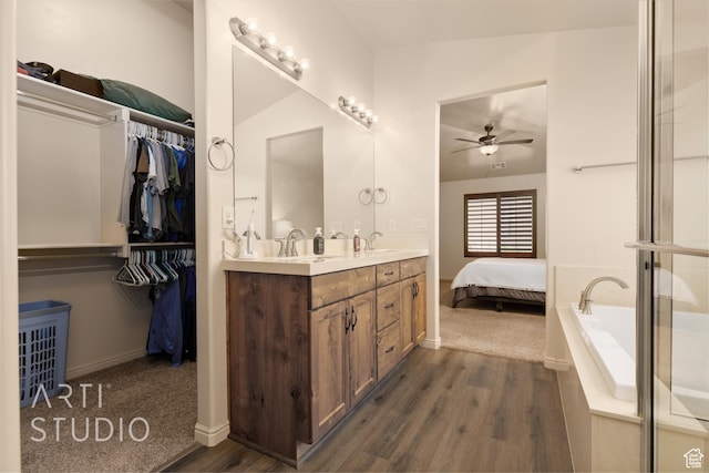 3504 E 3140 S, St George, UT 84790 - full bathroom with ceiling fan, wood finished floors, double vanity, and baseboards