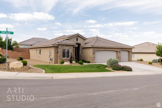 3504 E 3140 S, St George, UT 84790 - view of front facade with stone siding, stucco siding, concrete driveway, a garage, and a tiled roof