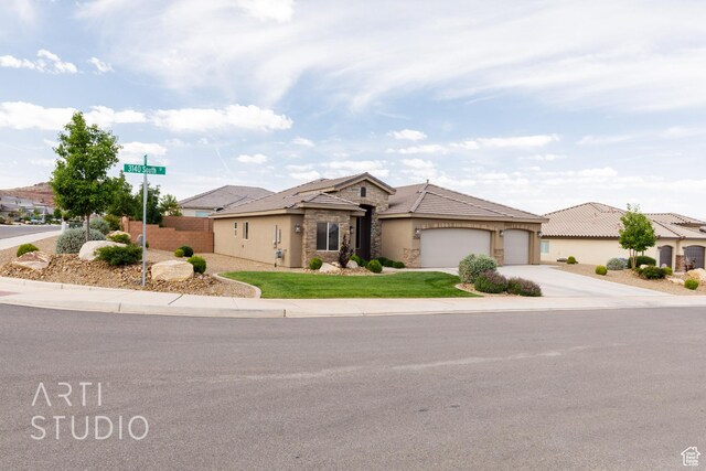 3504 E 3140 S, St George, UT 84790 - traditional home featuring stone siding, driveway, a garage, and stucco siding