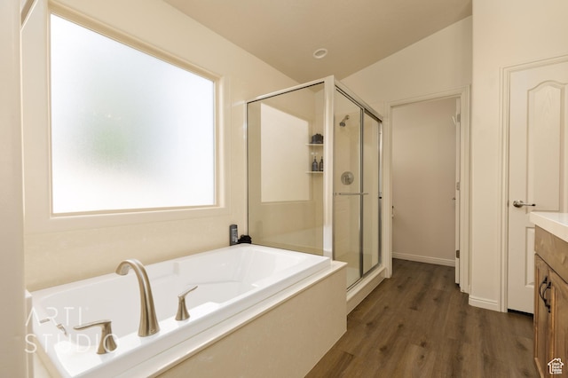 3504 E 3140 S, St George, UT 84790 - bathroom with a shower stall, wood finished floors, vanity, and a garden tub