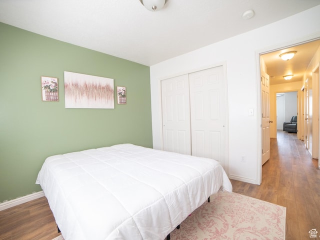 1305 S 1410 E, Provo, UT 84606 - bedroom featuring wood finished floors, baseboards, and a closet