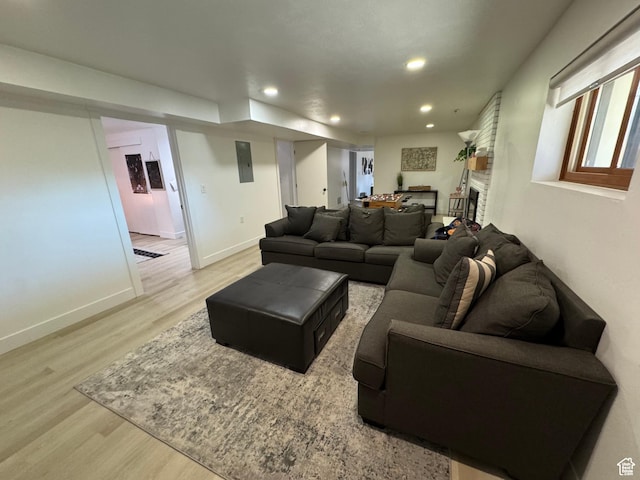 4288 S Shirley Ln, Holladay, UT 84124 - living area with light wood finished floors, recessed lighting, baseboards, and a brick fireplace