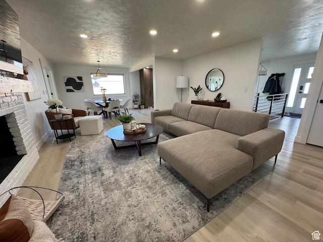 4288 S Shirley Ln, Holladay, UT 84124 - living area featuring wood finished floors, a fireplace, recessed lighting, and baseboards