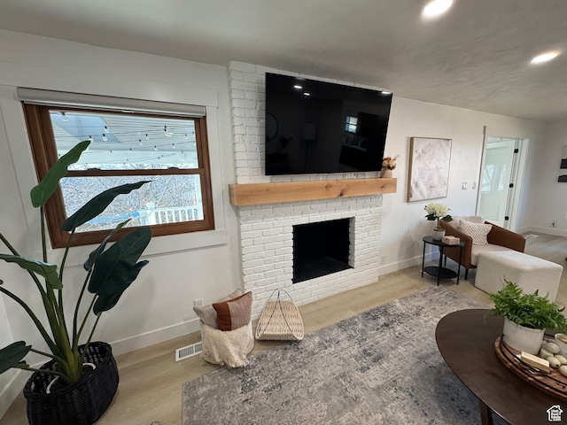 4288 S Shirley Ln, Holladay, UT 84124 - living room featuring wood finished floors, recessed lighting, baseboards, and a brick fireplace