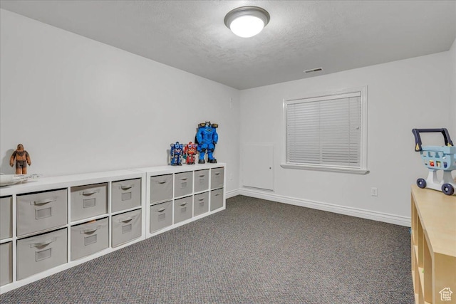 10605 S Willow Valley Rd W, South Jordan, UT 84095 - office area with a textured ceiling, dark colored carpet, and baseboards