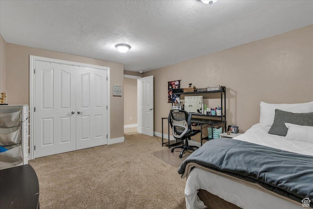 10605 S Willow Valley Rd W, South Jordan, UT 84095 - bedroom featuring light carpet, baseboards, a textured ceiling, and a closet