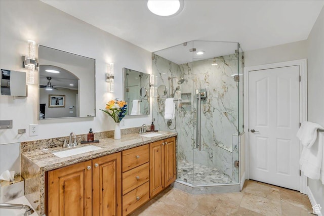 10605 S Willow Valley Rd W, South Jordan, UT 84095 - full bathroom featuring a marble finish shower, double vanity, and ceiling fan
