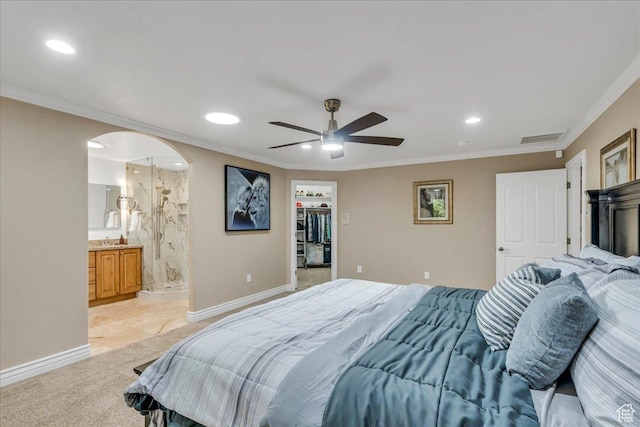 10605 S Willow Valley Rd W, South Jordan, UT 84095 - bedroom with recessed lighting, ornamental molding, arched walkways, a walk in closet, and light colored carpet