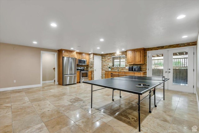 10605 S Willow Valley Rd W, South Jordan, UT 84095 - game room featuring baseboards, french doors, a sink, and recessed lighting