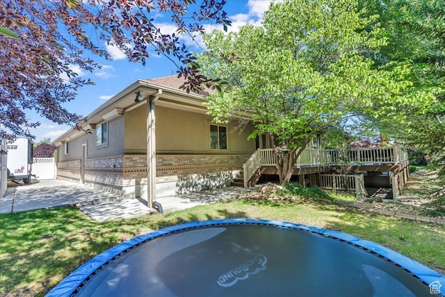 10605 S Willow Valley Rd W, South Jordan, UT 84095 - back of house featuring brick siding, stucco siding, stairs, and a deck