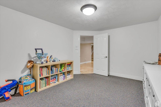 10605 S Willow Valley Rd W, South Jordan, UT 84095 - rec room with carpet flooring, a textured ceiling, and baseboards
