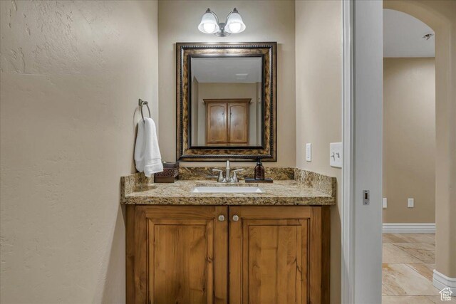 10605 S Willow Valley Rd W, South Jordan, UT 84095 - bathroom with vanity, baseboards, and a textured wall