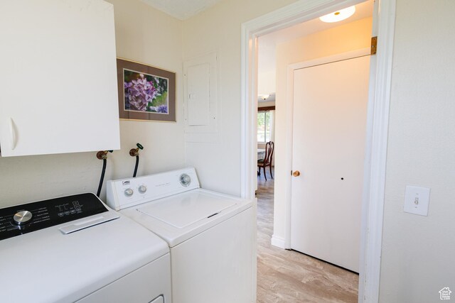 374 W Melba Dr S, Tooele, UT 84074 - laundry area with light wood finished floors and independent washer and dryer