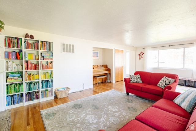 374 W Melba Dr S, Tooele, UT 84074 - living area featuring wood finished floors and baseboards