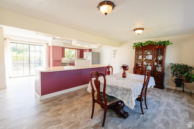 374 W Melba Dr S, Tooele, UT 84074 - dining room featuring plenty of natural light and baseboards
