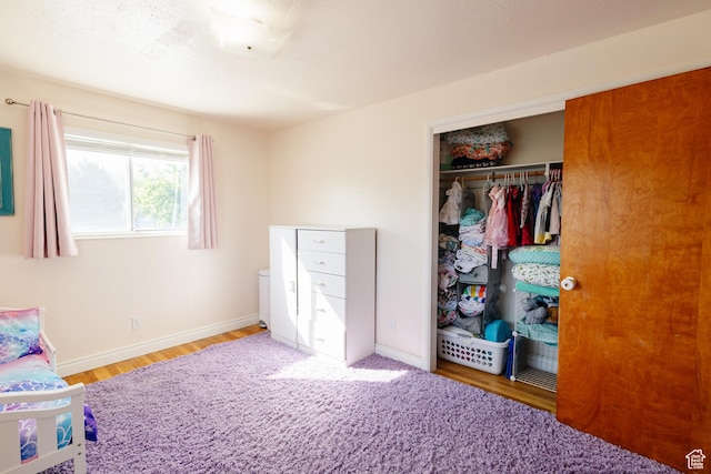 374 W Melba Dr S, Tooele, UT 84074 - bedroom featuring a closet, wood finished floors, and baseboards