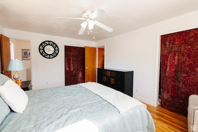 374 W Melba Dr S, Tooele, UT 84074 - bedroom with wood finished floors, a ceiling fan, and baseboards