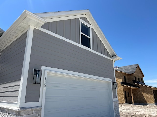 1154 E 1150 S, Garland, UT 84312 - view of side of property featuring board and batten siding and a garage