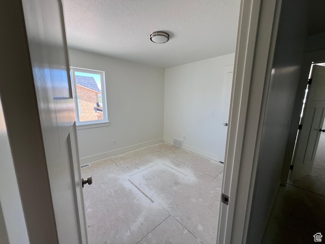 1154 E 1150 S, Garland, UT 84312 - empty room featuring a textured ceiling and baseboards