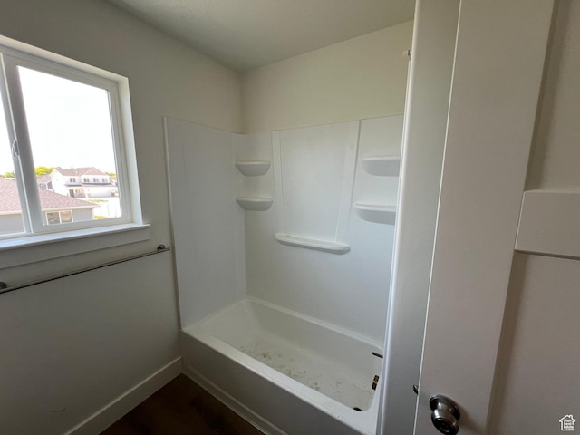 1154 E 1150 S, Garland, UT 84312 - bathroom featuring washtub / shower combination and baseboards