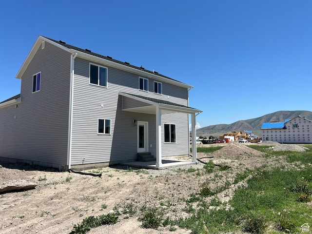 1154 E 1150 S, Garland, UT 84312 - back of property with a mountain view and a patio area