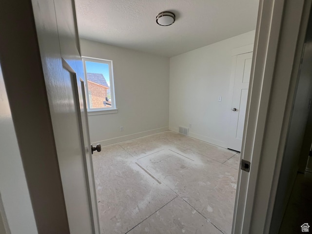 1154 E 1150 S, Garland, UT 84312 - empty room with baseboards and a textured ceiling