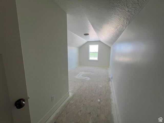 1154 E 1150 S, Garland, UT 84312 - bonus room featuring vaulted ceiling, a textured ceiling, and baseboards