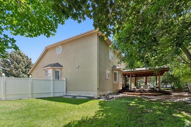 12214 S Hidden Valley Rd, Sandy, UT 84092 - rear view of house with stucco siding and a patio