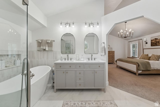 12214 S Hidden Valley Rd, Sandy, UT 84092 - ensuite bathroom with double vanity, vaulted ceiling, a freestanding tub, a chandelier, and marble finish flooring