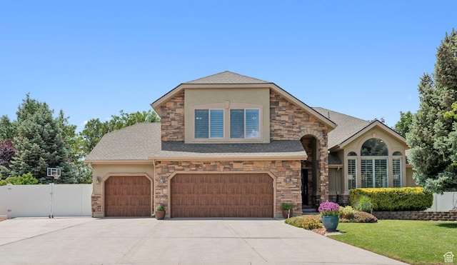 12214 S Hidden Valley Rd, Sandy, UT 84092 - view of front of home featuring stone siding, stucco siding, concrete driveway, and an attached garage